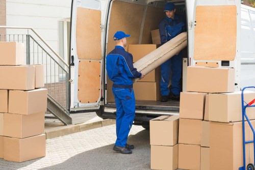 Home moving team working in a Belsize Park residential street