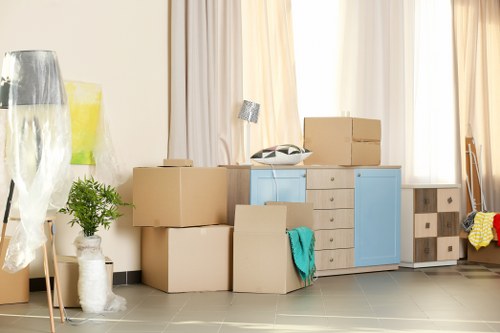 Removal van and moving boxes in a Belsize Park residential street