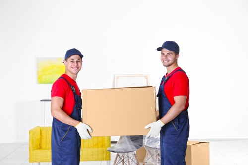 Removal van and movers preparing a local move in Belsize Park