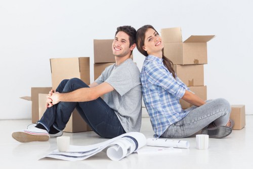 Moving team handling furniture in a Belsize Park flat