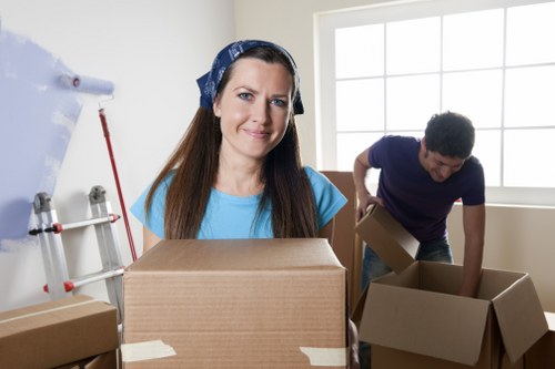 Local moving truck loading household furniture and boxes