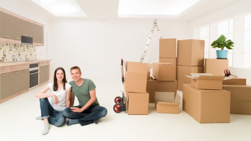 Customer and mover confirming booking details for a van service