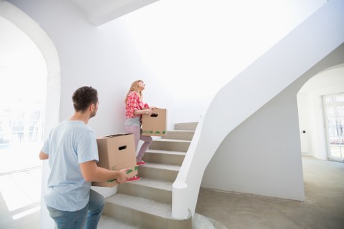 Moving boxes and furniture being loaded for a local house move
