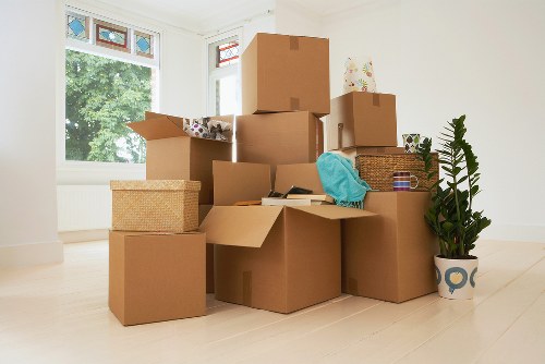 Removal team managing household items and boxes for a Belsize Park move